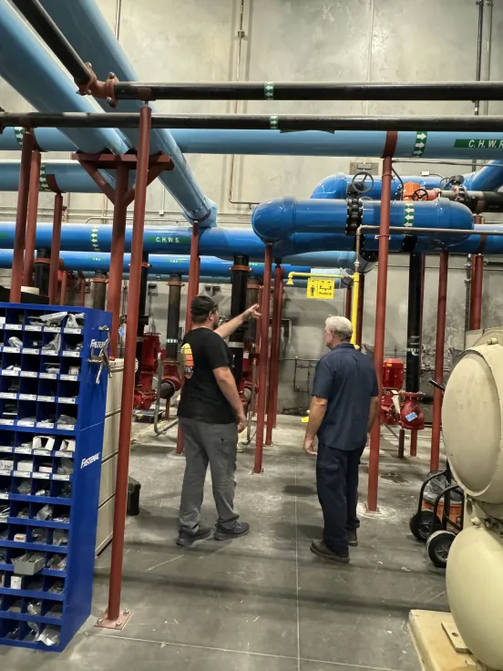 Technician working on an HVAC unit outdoors